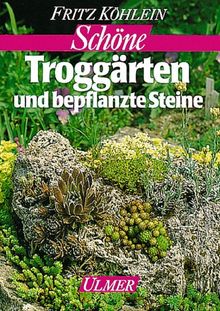 Schöne Troggärten und bepflanzte Steine